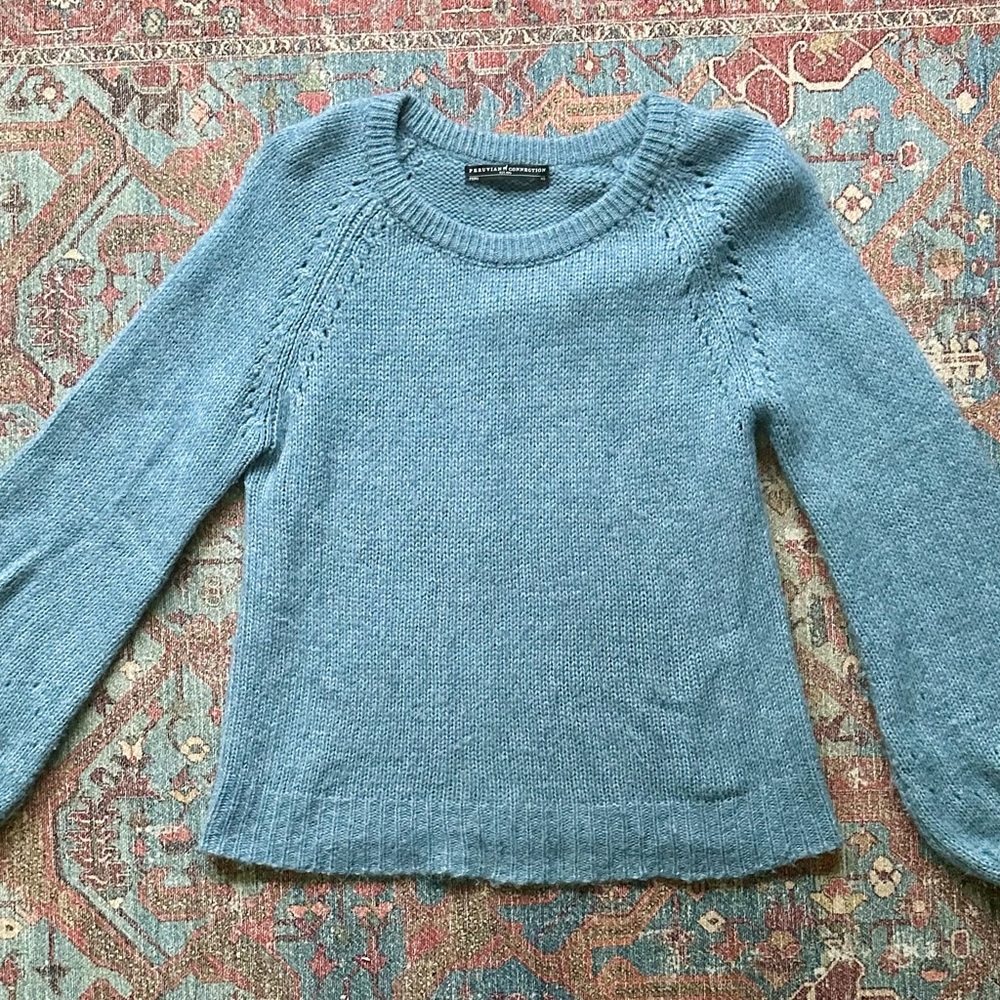 Women's blue wool sweater with bell sleeves. Size is xs but can fit s and m.